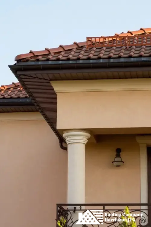 Elegant home with red tile roofing installed by skilled roofing professionals.